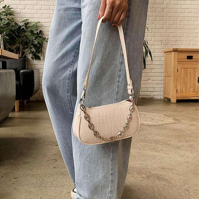 woman beige croc embossed handbags