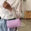 woman purple croc embossed handbags